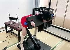 Chinese slave in costume has a fuck machine plowing her cunt