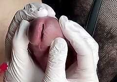 Close-up glans play with white latex gloves for some intense action
