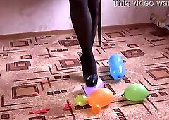 Balloon popping fetish with high heels and foot fetish with legs in nylon stockings. Looner girl