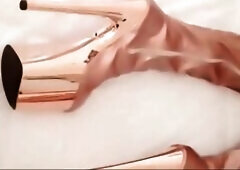 Gold knee high boots, fishnet nylons, micro petticoat and a white mini top