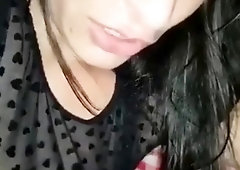 Luscious amateur brunette sucks and strokes a cock in public