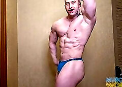 Massive Muscle God Flexes Hard Muscles Up Close