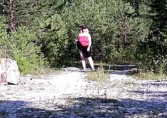 A large bush on the vagina of a aged big beautiful woman, upskirt in the park.