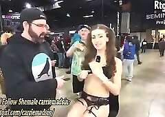 A thin transgender girl interacts with fans at the exhibition