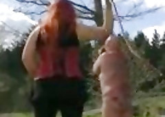 Mistress Anne Katrine whips her slave outdoors BDSM fetish porn