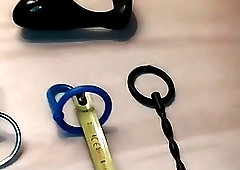 Freak with a fetish uses a device on his prick