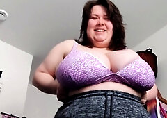 Busty curly brunette with big boobs fucks on couch