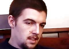 A couple of sexy boys trade blowjobs while watching porn