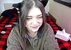 Blue- eyed girl is sucking a big, fake dick and drilling her tight pussy with it