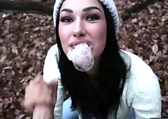 Gorgeous brunette teen sucking off a big dick in the woods