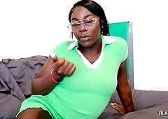 Ebony trans woman in green costume undresses exposed, positions, and masturbates on daybed.
