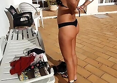 Hawt angel undressing in a public pool