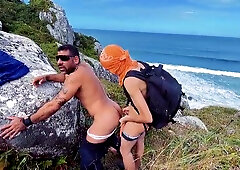 A cheeky surfer getting a prick and urinate from a tourist.