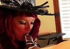 Mature goddess wraps her lovely lips around caged cock