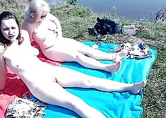 Older mom and youthful angel sunbathing on wild beach out of garments exposed in public large butt large melons natural boobs