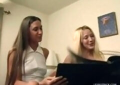 Two cute coed babes with big boobs have a strap on that does wonders for them