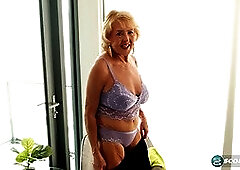 Check out our kinky blonde MILF desiree eden, our kinky GILF, return to show off her big tits and finger her