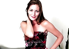 A wraparound costume hugs each one of Vivian Smith's slender curves as the hawt housewife shows off her dance moves. The fabric not fast pools on