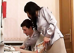 Natalie sees a chap jerking off behind his work desk.