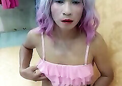 Oanh Le transgender wearing sexy porn clothes playing anal with an artificial cock is happy