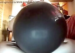 A huge black balloon will be used as if it were a big hard cock!