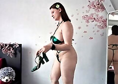 Getting willing for summer with my fresh shiny green micro bikini! In this movie scene I try it on add some cute accessories heels and a little robe w