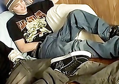 Naughty twinks tease with their feet and jerk off together