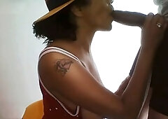 Dark-skinned beauty Boricualovenyc gives a deep throat blowjob to a massive cock