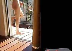 Masturbating naked in his balcony 4