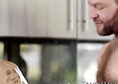 Tattooed pretty tranny Jessy Dubai widens her legs to receive a hardcore screw in the kitchen from her hirsute hung dude.
