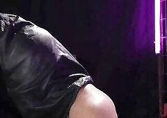 Standing in her dungeon wearing a hawt ebony latex corset with matching latex haunch-highs, Chelsea Marie is already in full swing, spanking the back 