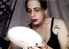 Large Soaked lips, slathered with darksome red lipstick. Picking giving a kiss beautiful red bulky lips with lip piercings