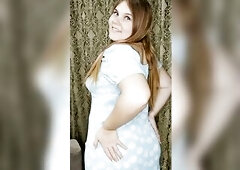 This redheaded beauty looks very nice-looking in this blue suit.