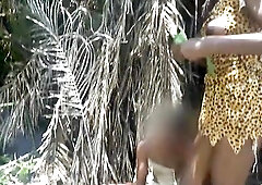 two Afro tribe beauties stroking their chief with their butts in the river