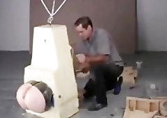 BDSM encased slave tortured with only his big ass free