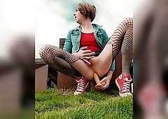 Clothed in converse sneakers and tights in public pissing on the street