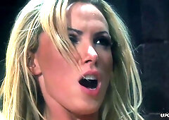 Gina Lynn and Penny Flame share an intimate moment with long hair and piercings on full display