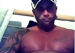 Tattooed guy in rose panties jerking off