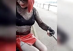 sissy showing off on a public bench