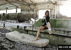 A bombshell girl tied up in a warehouse & cumming hard