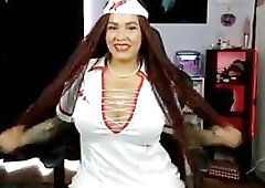 Naughty shemale in a nurse outfit teases with her body