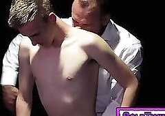 Twink stripped naked on an auction block, and groomed by older man