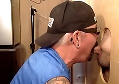 Mature queer at a gloryhole gives a deep blowjob until cumshot