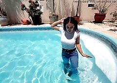 April Large Booty turns a sunny pool day into a slow, provocative outdoor tease. Beginning in taut jeans, a soaked white top, and ebony boots, that ba