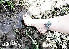 Exposed feet in mud