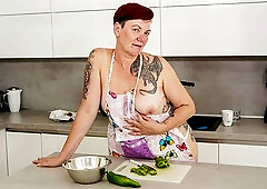 Redhead mature lady Gia R is sucking with vegetables