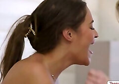 Yoga instructor sits on the face of her client