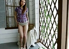 Seductive teen with perky boobs puts on sensual strip show