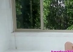 Trans woman jerks off teasingly in bath tub