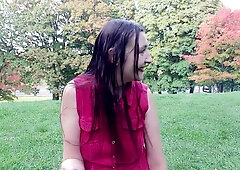 Gypsy Dolores bares it all in a red shirt while smoking in an autumn park